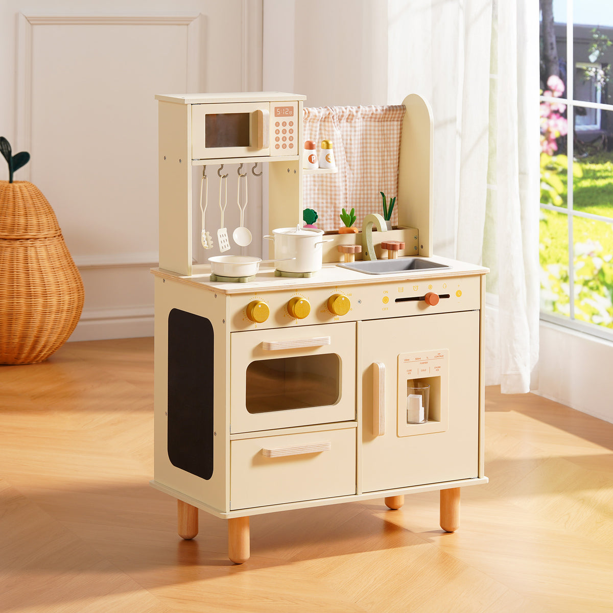 ROBUD cream wooden play kitchen with oven, microwave, and pot rail, displayed in a bright sunlit playroom.