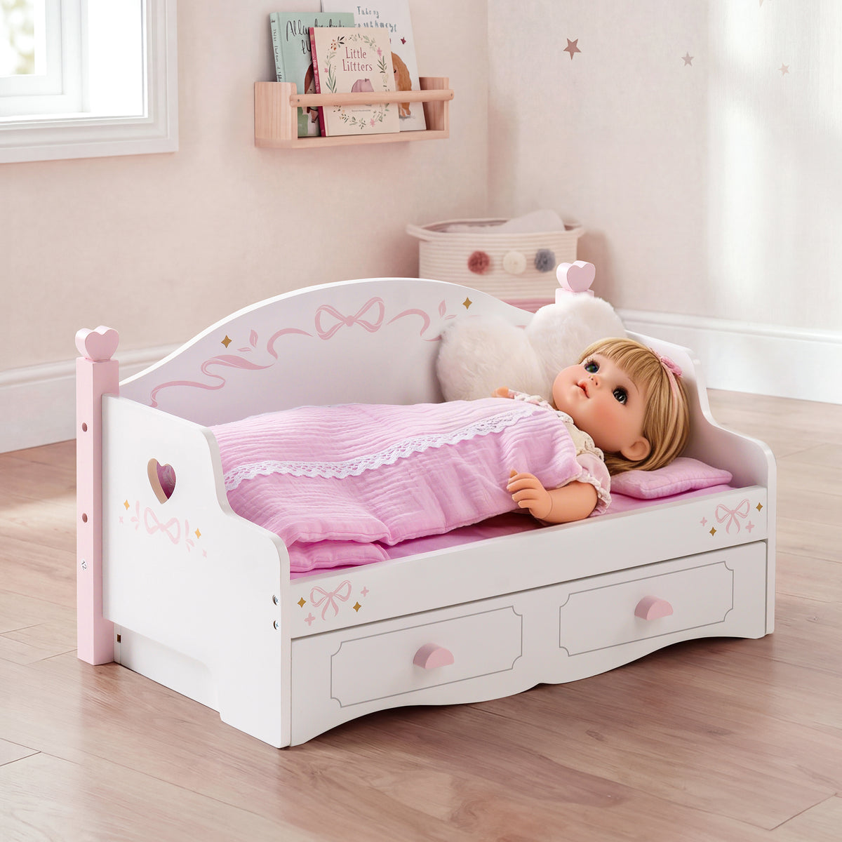 ROBUD white doll sofa bed styled in a pink room with baby doll tucked in under pink lace quilt with heart-carved back panel