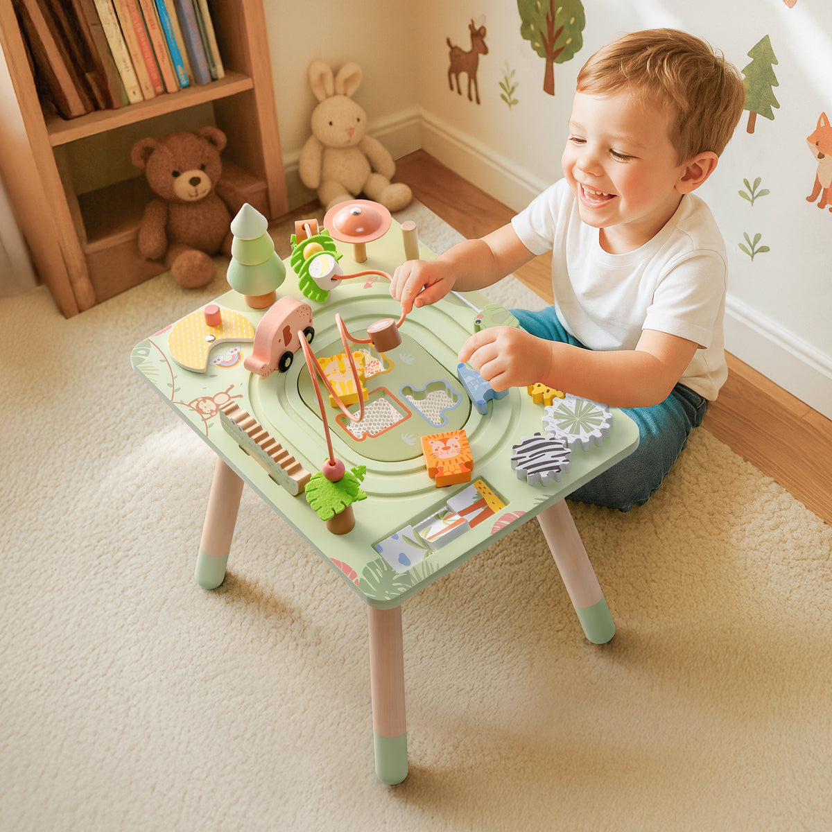 Young boy playing with ROBUD Wooden 11 in 1 Rainforest Activity Table in a bright forest-themed nursery with wooden decor