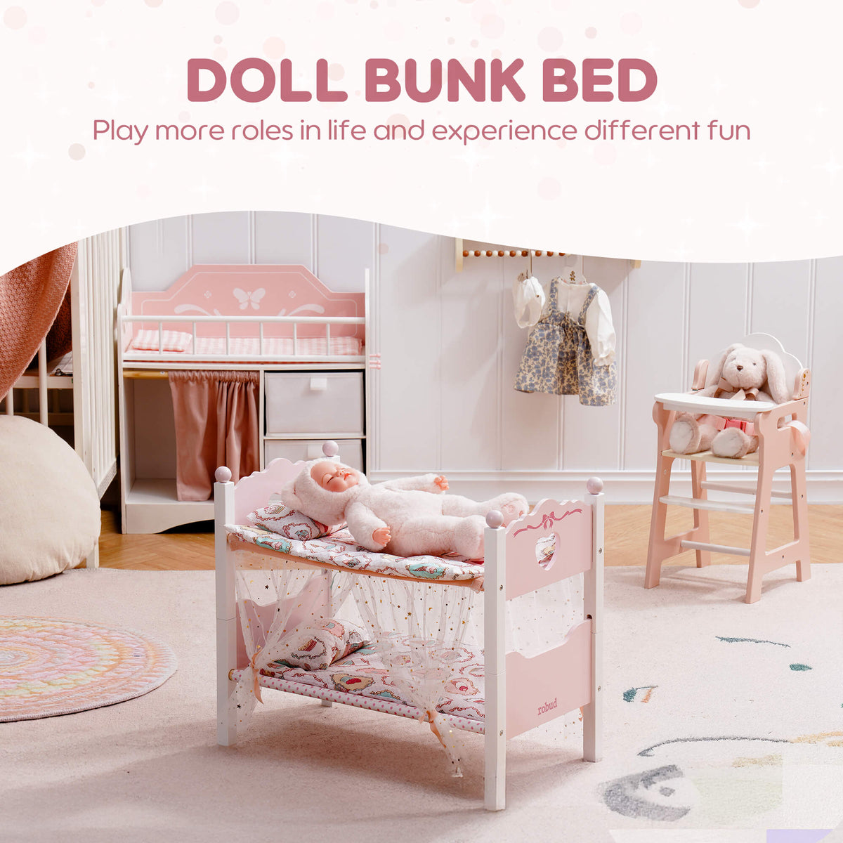 ROBUD pink doll bunk bed in a decorated playroom with a baby doll lying inside and text reading Doll Bunk Bed for immersive role play