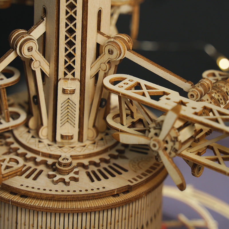 ROKR Airplane Control Tower close-up of wooden biplane wing and gear mechanism on the rotating carousel arm