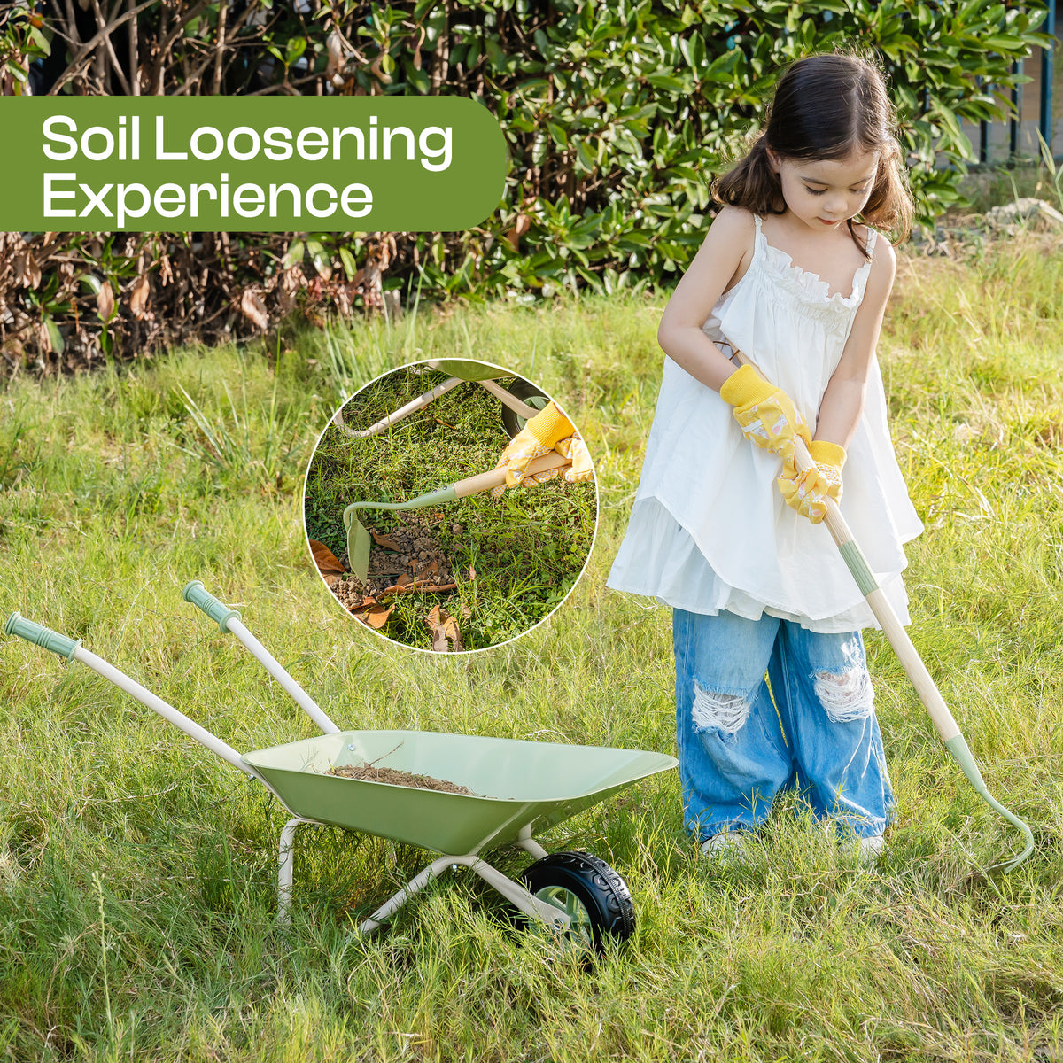 Girl loosening garden soil using wooden-handle fork from ROBUD Kids Wheelbarrow Set beside sage green wheelbarrow in outdoor setting