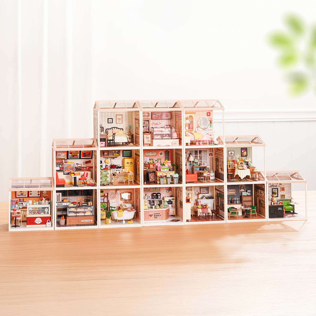 Rolife Super Creator 15 in 1 DIY miniature house full collection displayed in a long row