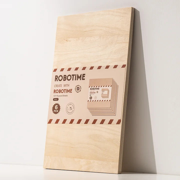 Robotime plywood sheet package showing branded label at lower right, pale birch board leaning against white wall