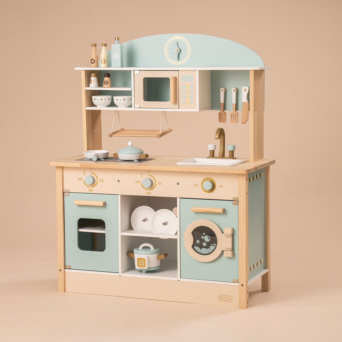 ROBUD WCF14 mint kitchen with washing machine panel, oven and open shelf stocked with toy dishes.