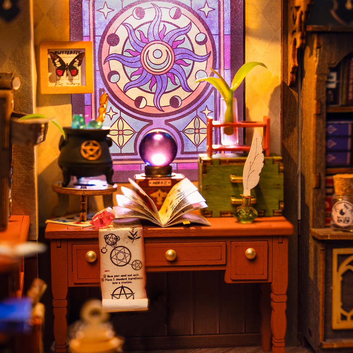 Rolife Magic Study desk scene shows an open book beneath a purple circular window.