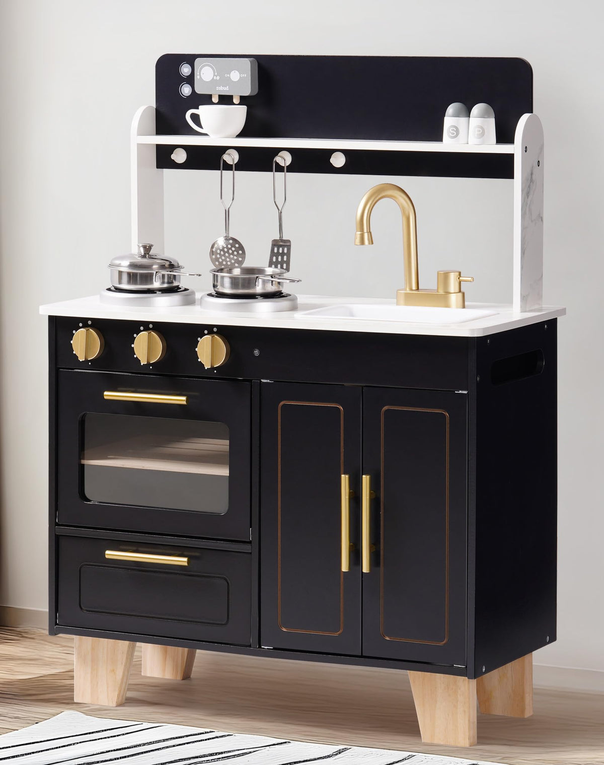 ROBUD obsidian kitchen playset side angle showing oven door, drawers and gold faucet on white background