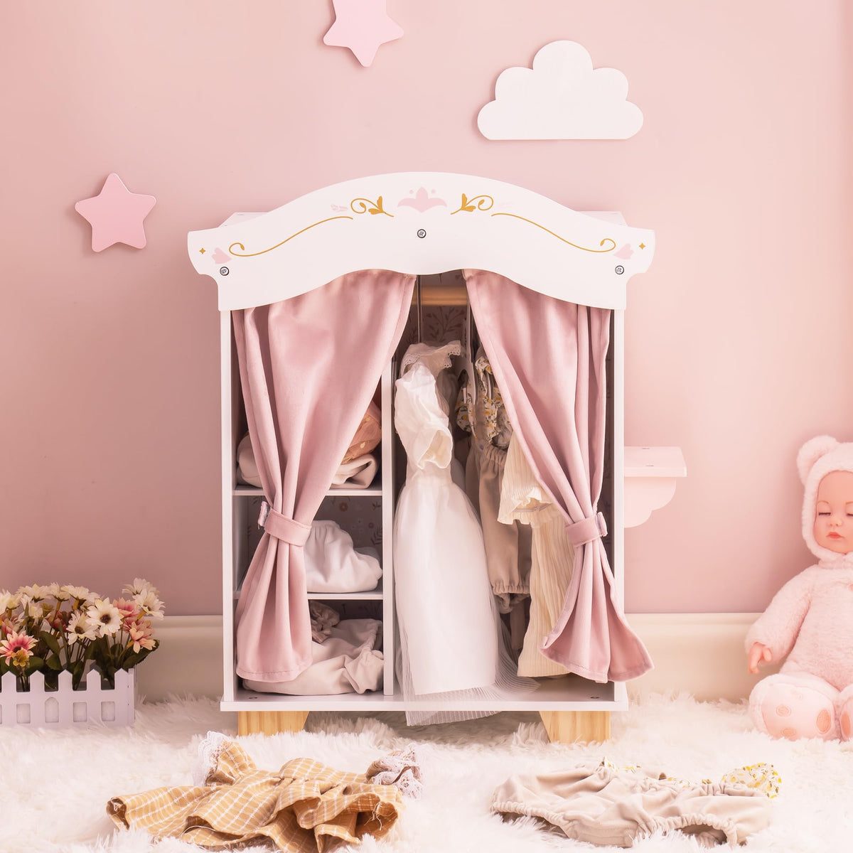 ROBUD wooden princess doll wardrobe open on a pink wall with star décor, showing mini doll dresses hanging on white hangers.