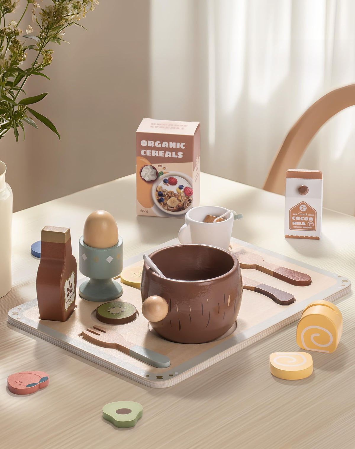 ROBUD wooden play food set laid out on tray with egg cup, cereal bowl, bottle and recipe box on light background