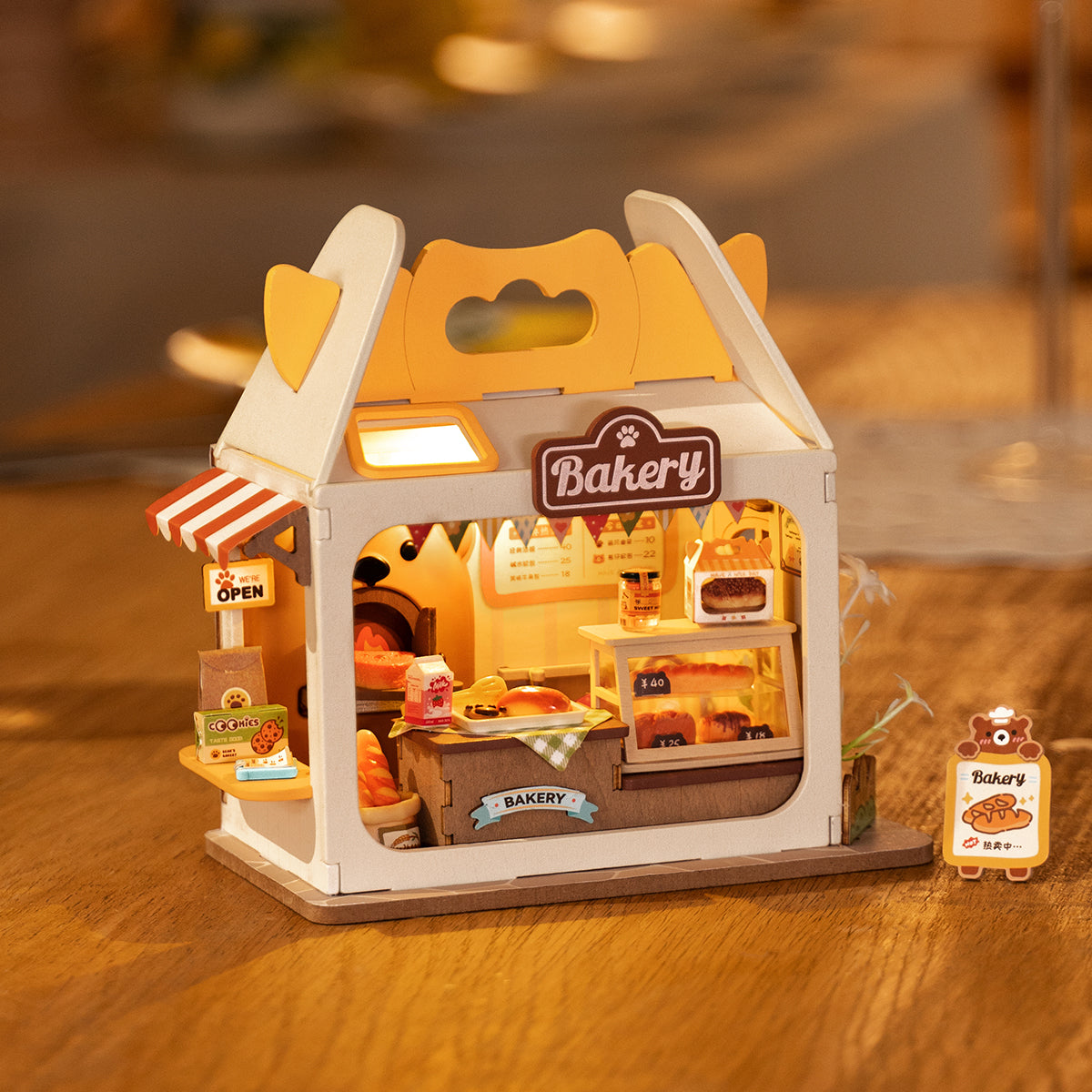 Rolife Food Box Shop DIY book nook miniature kit, completed model displayed on a shelf