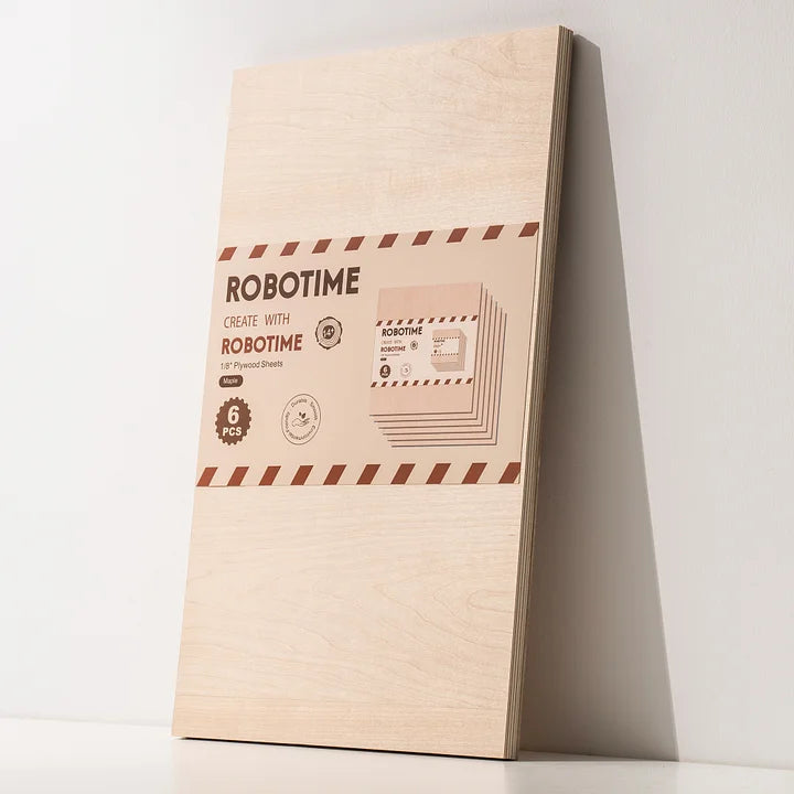 Robotime plywood sheet package leaning against white wall, pale birch grain with red branded label centered on face