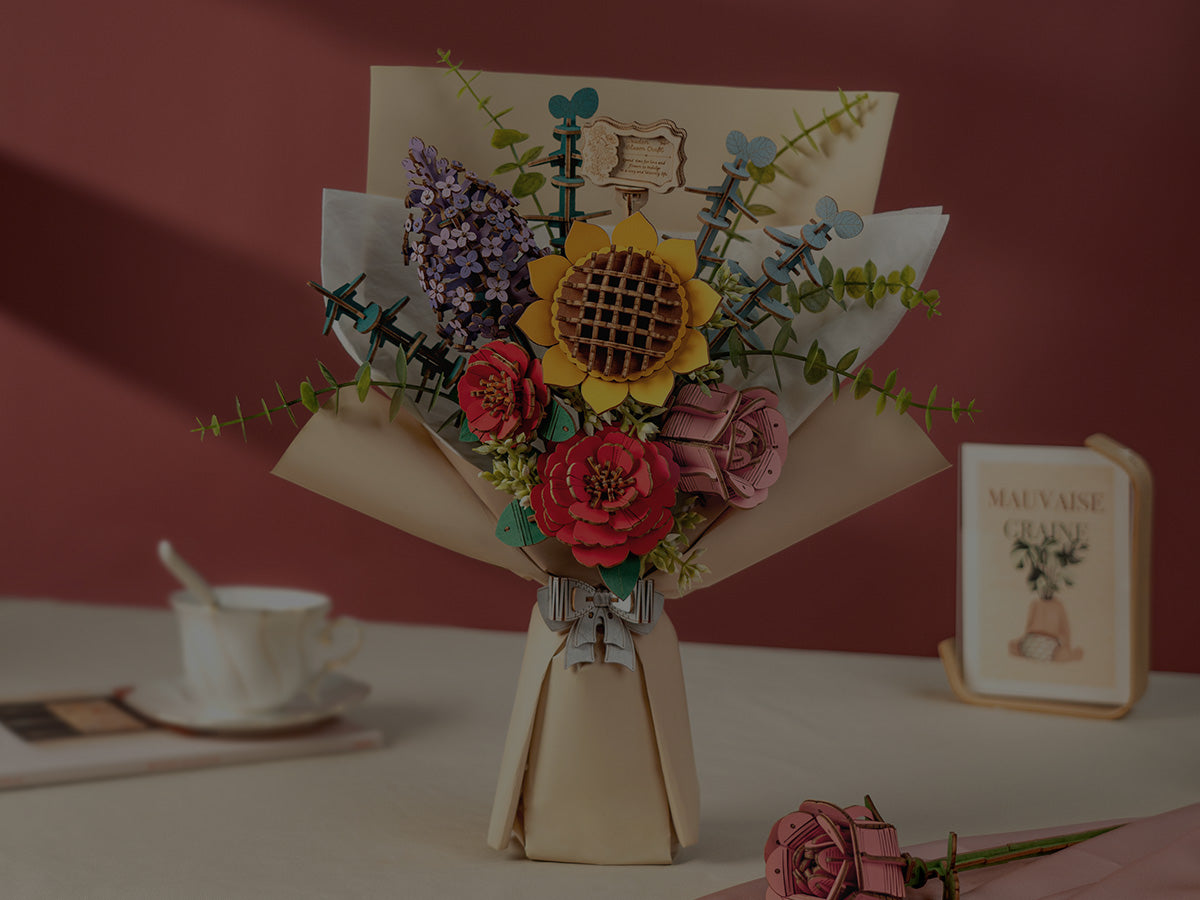 Rolife miniature greenhouse garden house kit with glass-effect roof, yellow door, potted plants and gardening tools set on a garden backdrop