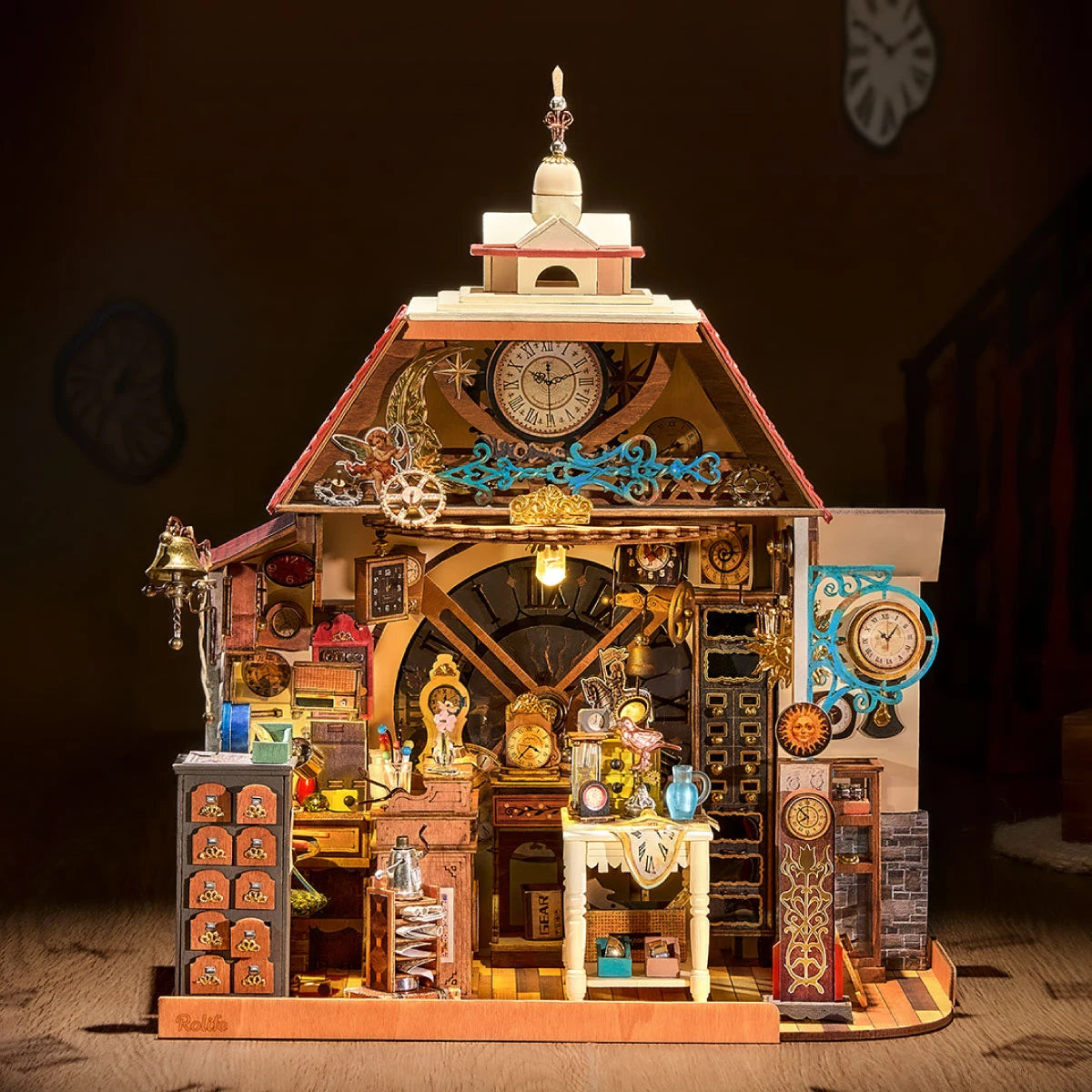 Rolife miniature clock shop glowing in a dark room, with red roof, large clock face, tiny furniture and warm interior lighting.