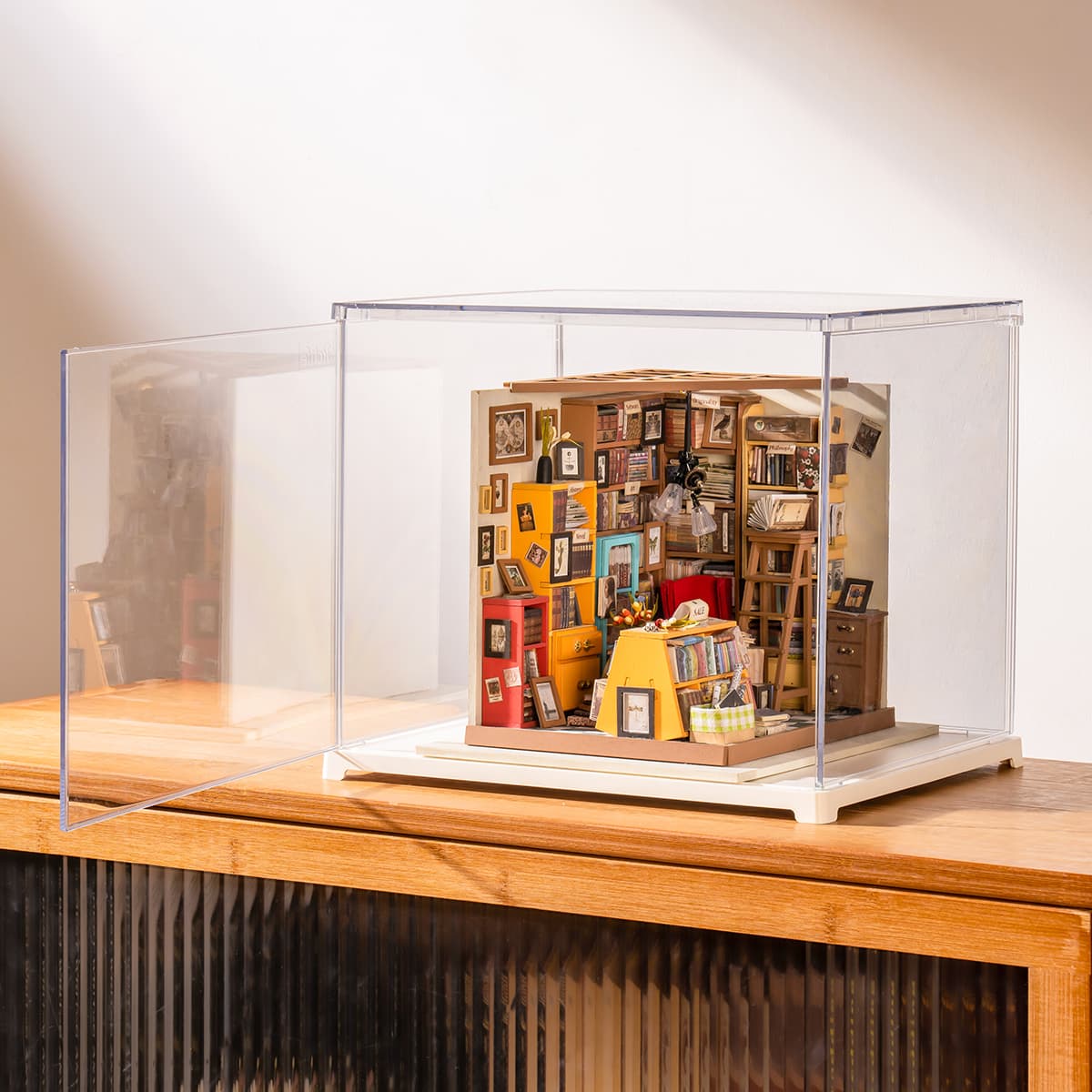 Rolife Sam's Study Library display box rests on a cabinet with warm room light behind it.