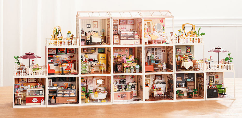 Robotime Online DW PC banner showing the full Rolife Super Creator Series modular miniature dollhouse in a wide bright room setting