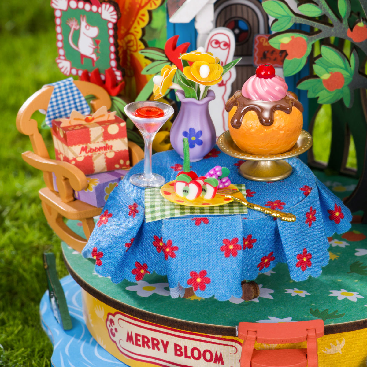 Snorkmaiden Garden Party table detail with cake, drinks and colorful flowers