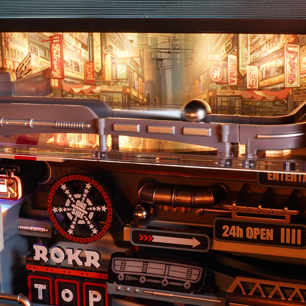 ROKR Parallel World Marble Run MR02S interior detail showing the glowing city street mural backdrop with steel ball track and arrow signs
