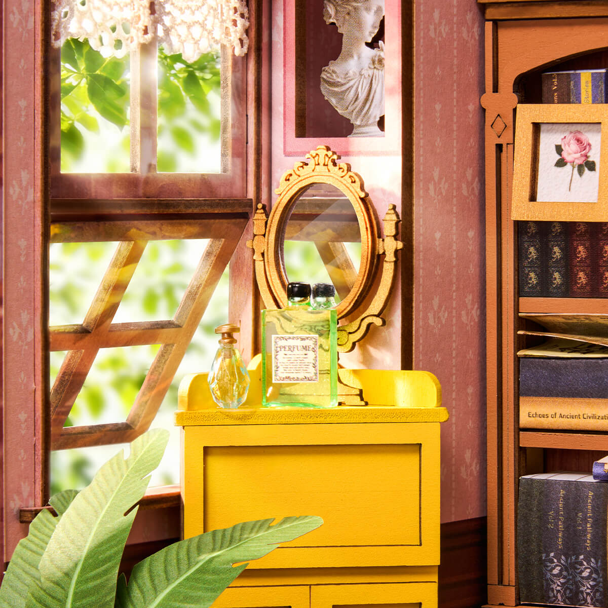 Interior detail of Rolife Quiet Corner Study book nook showing a yellow dresser with a gold oval mirror and perfume bottles