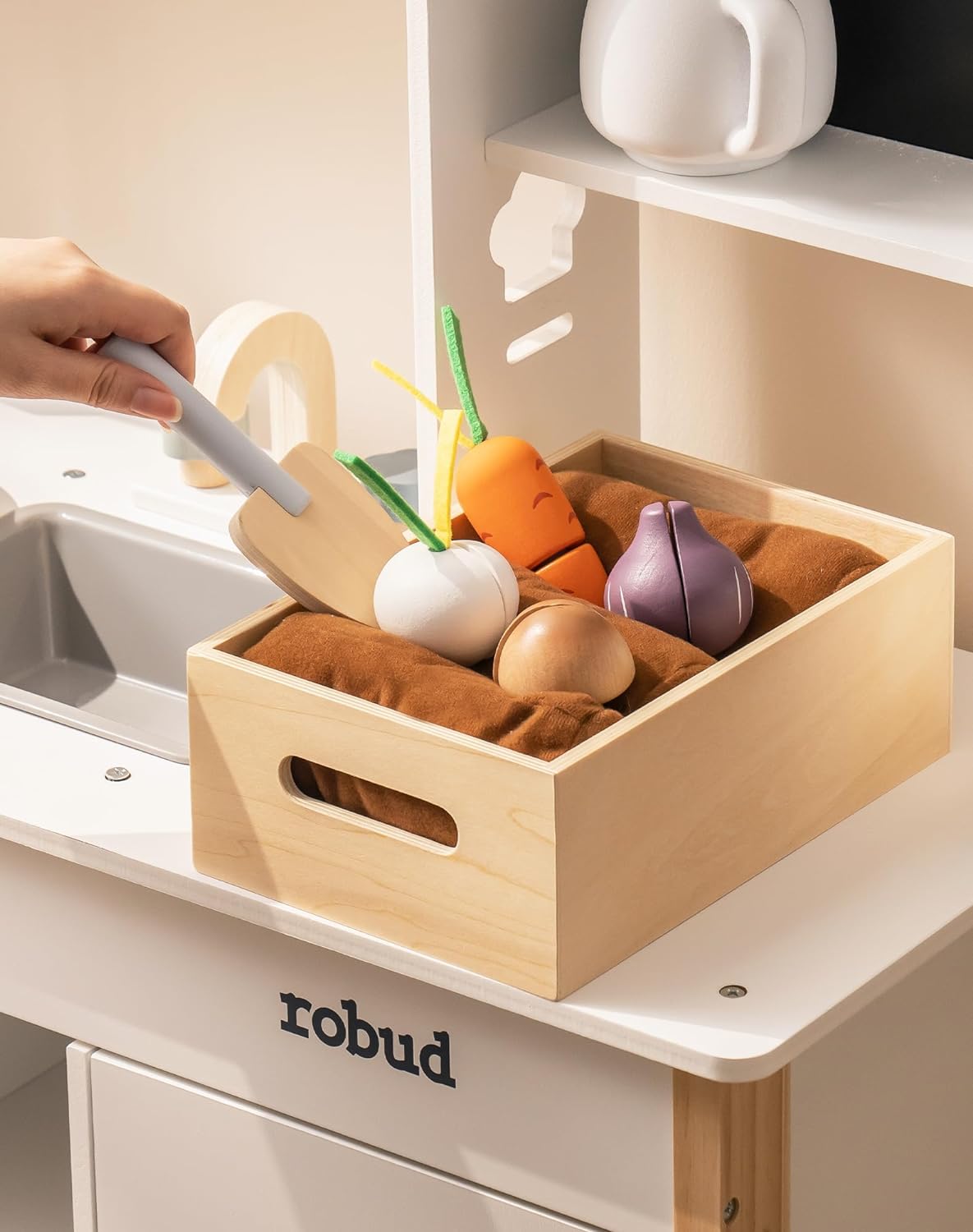 Robud kitchen playset close-up of wooden crate with toy vegetables including carrot, onion and mushroom