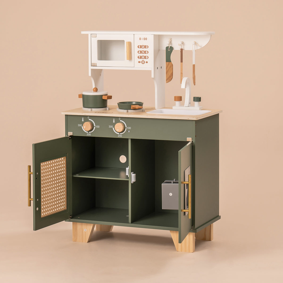 ROBUD green kitchen toy unit with open lower cabinet doors revealing interior shelves and storage.
