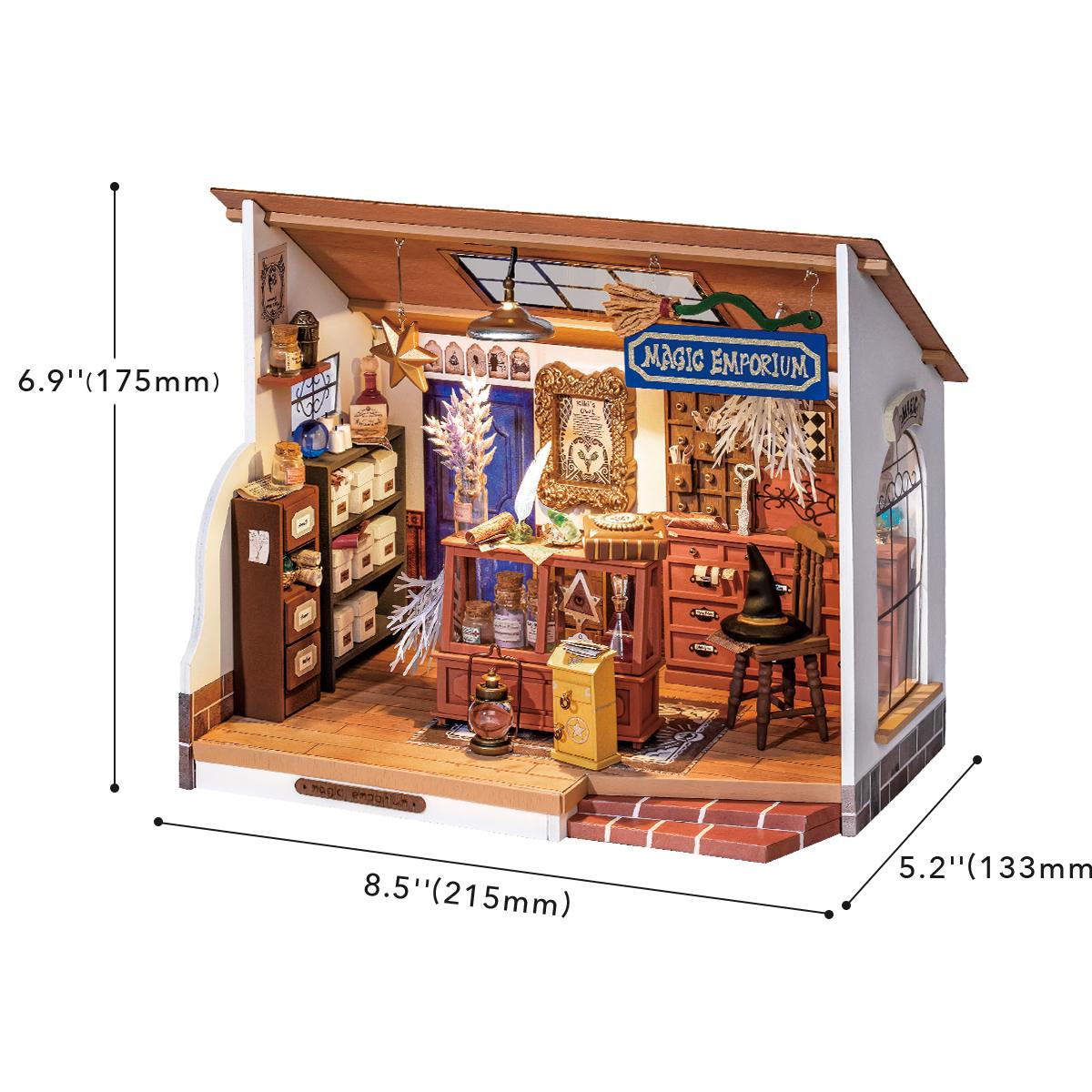 Rolife Kiki's Magic Emporium DIY kit top-down view showing open diorama with purple and teal decor, shelves, and miniature books