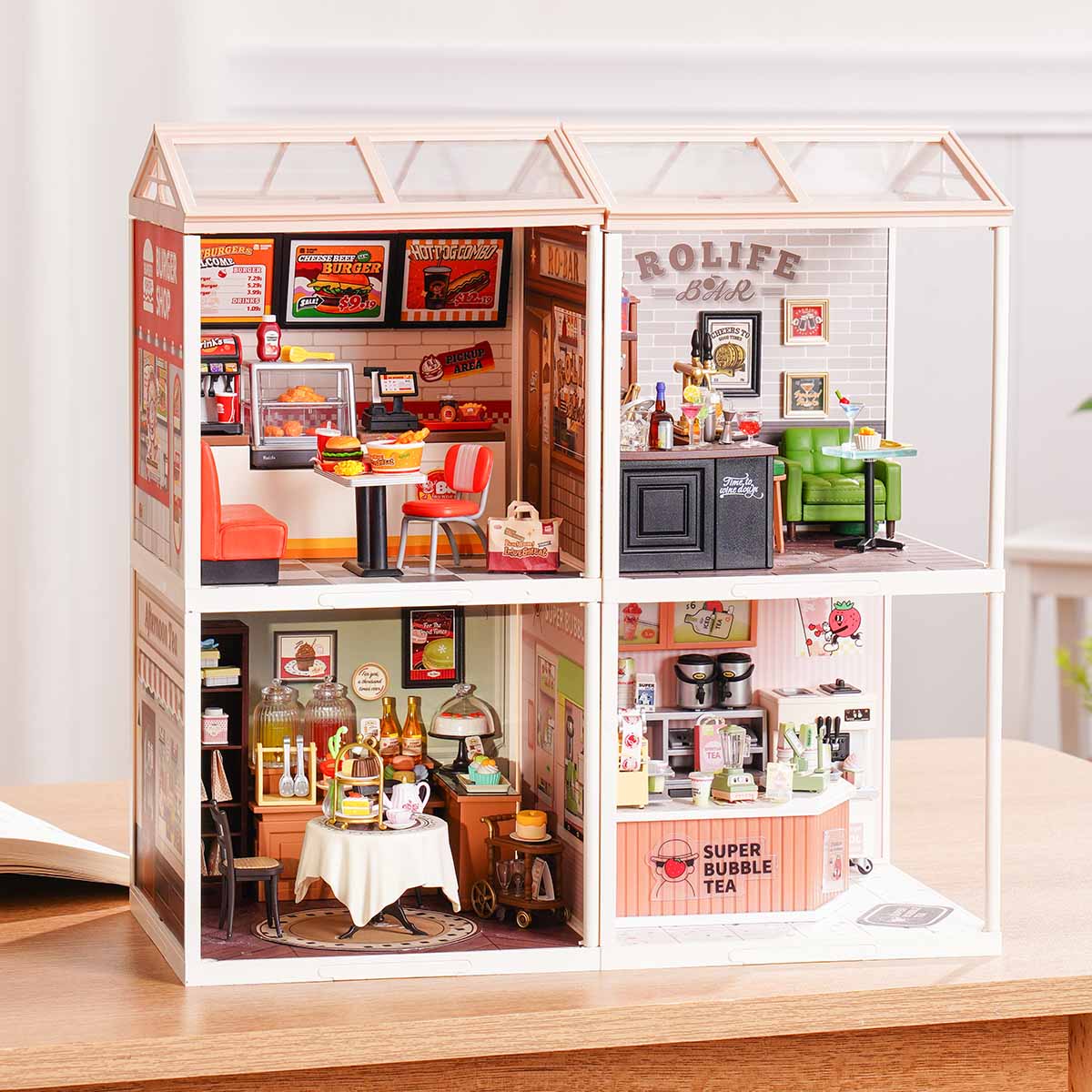 Rolife Super Creator Series 4-in-1 Four Grid miniature showing four shop modules including cake bakery, ice cream counter, living room study, and flower shop with red umbrella rooftop.