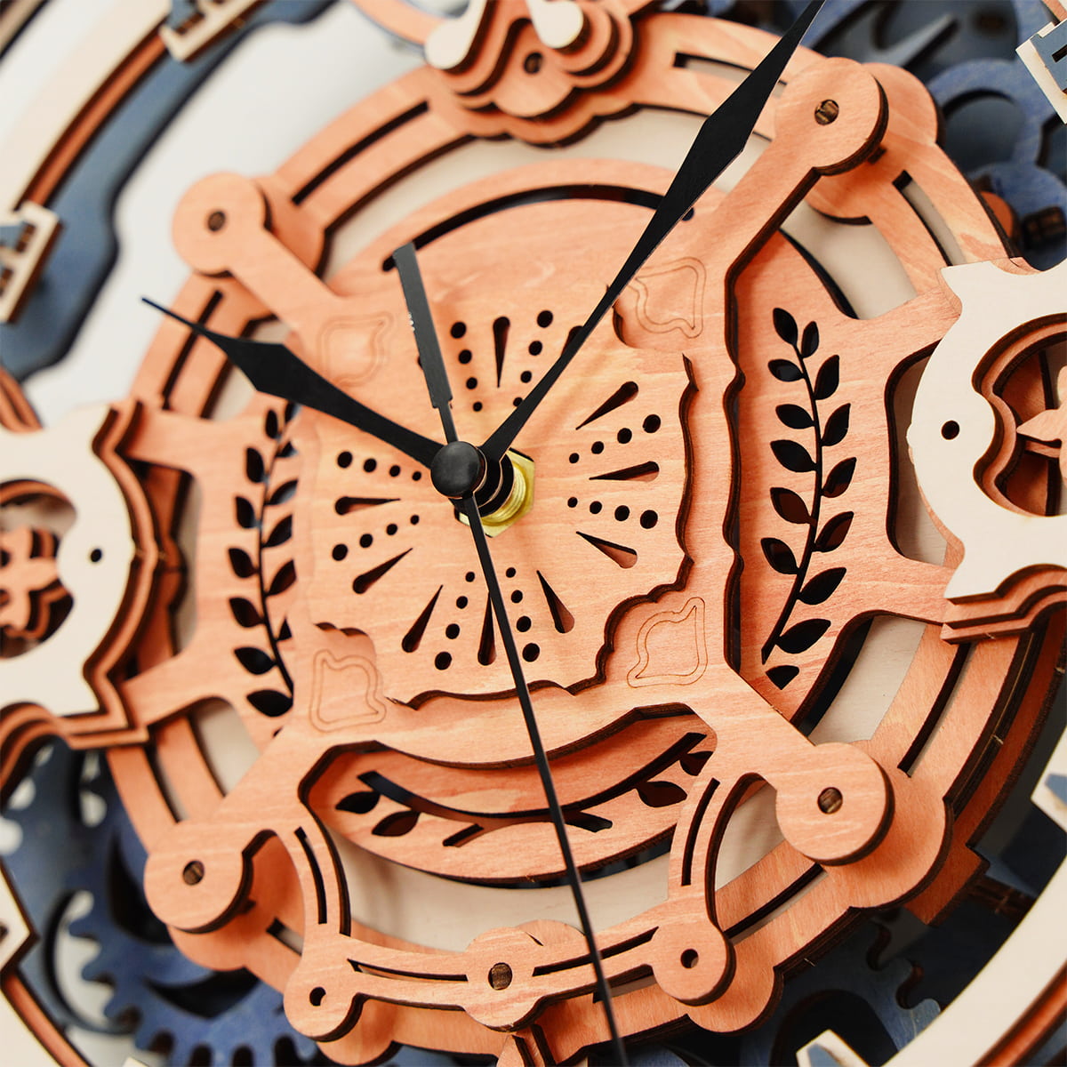 ROKR Romantic Note Wall Clock face center with butterfly motif, leaf engravings, and clock hands in layered natural wood tones