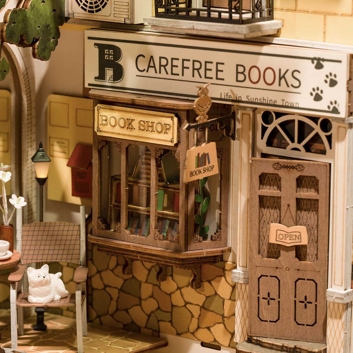 Rolife Sunshine Town book nook front facade showing Carefree Books shop with stone exterior and cat in the window