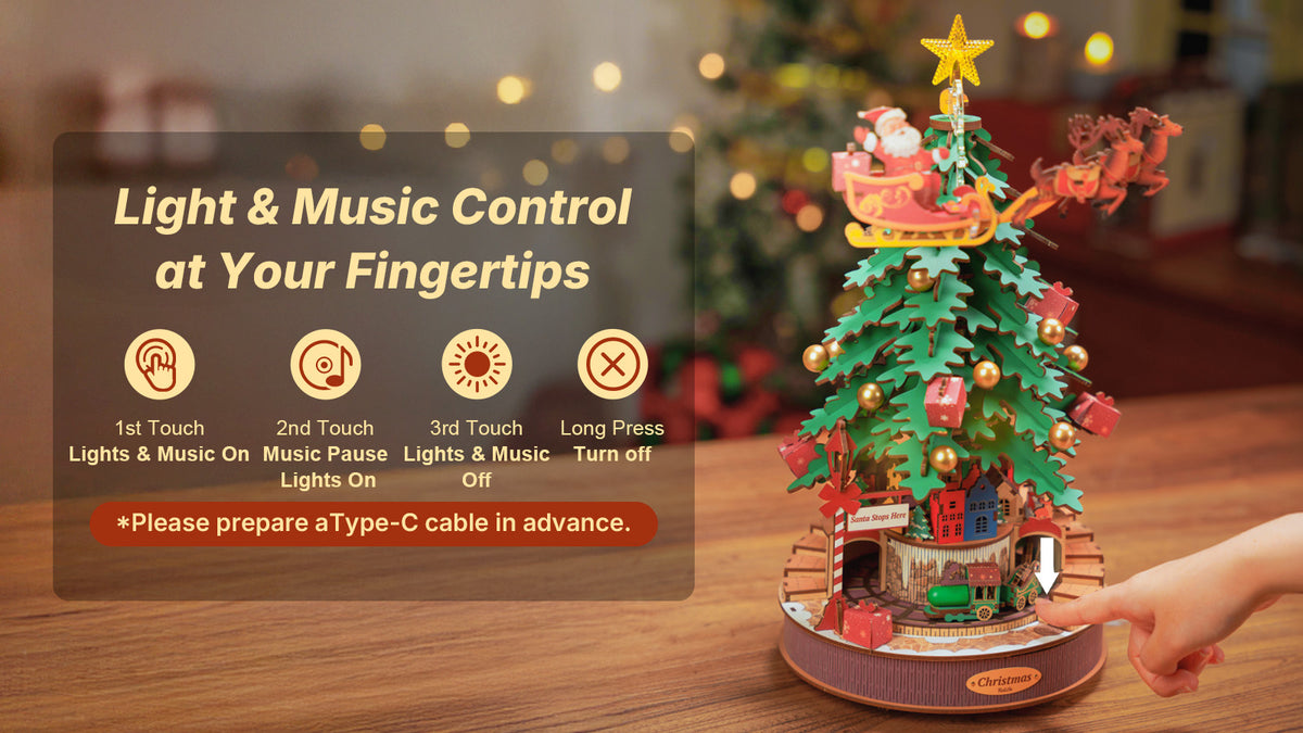 Rolife Christmas Melody Tree AMS01 wooden music box showing touch-control light and music features with a hand pressing the base button