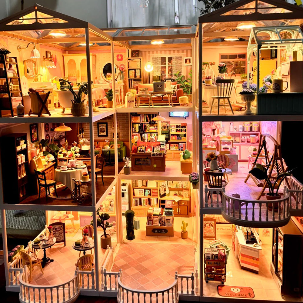 Rolife Super Creator large illuminated multi-story dollhouse photographed in a bright room, showing detailed room vignettes.