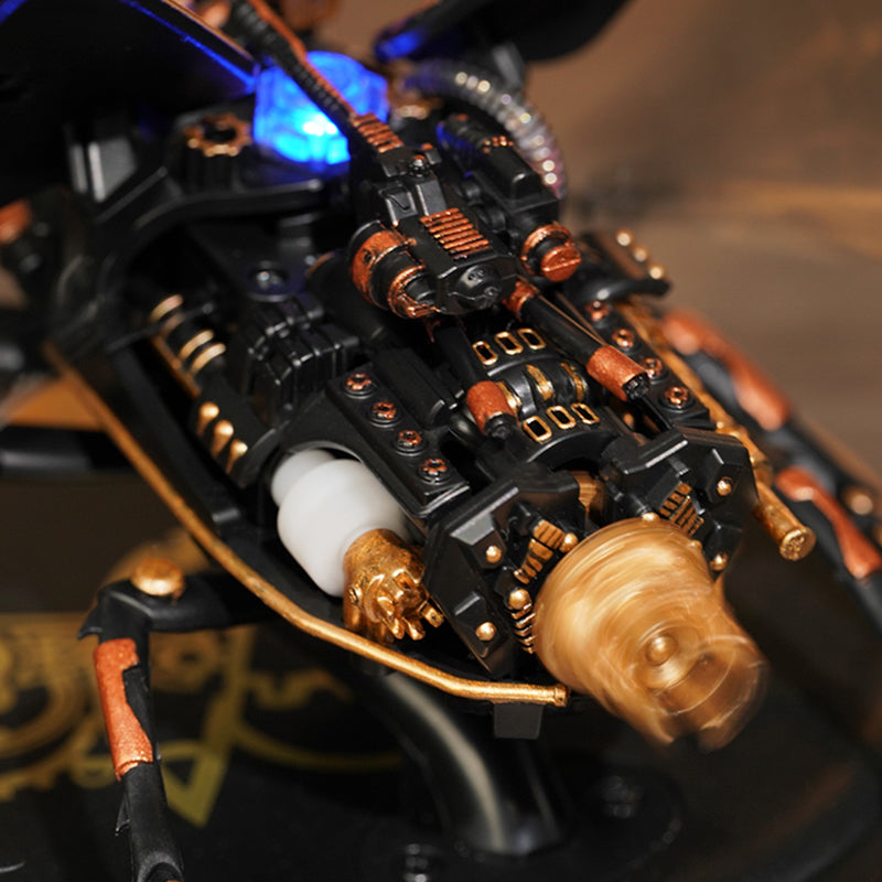 ROKR Storm Beetle MI03 thorax detail with glowing blue LED and copper cylinder fittings visible