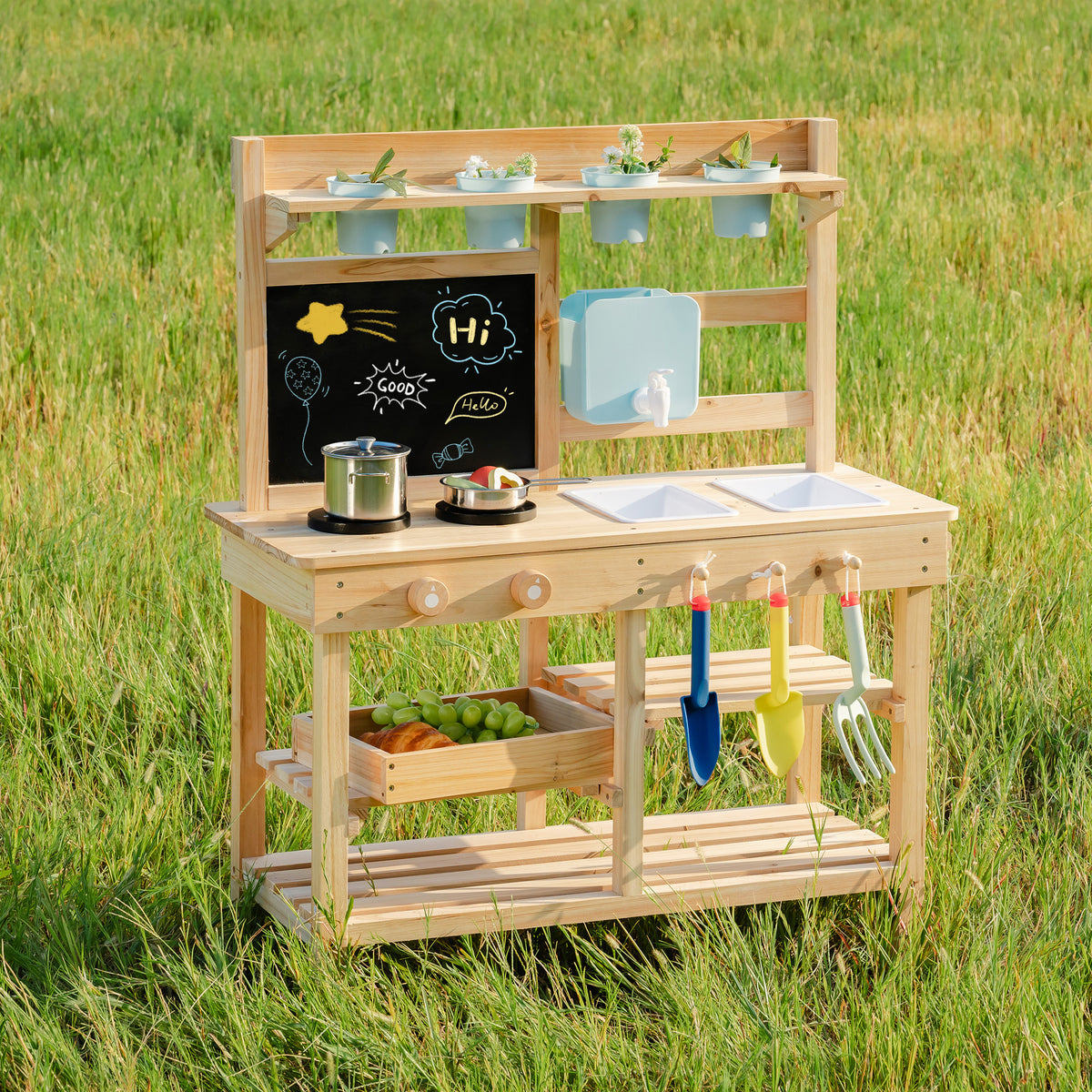 ROBUD Outdoor Garden Mud Kitchen front standalone view in garden showing chalkboard, sink basin, lower shelves and hanging tool hooks in natural wood