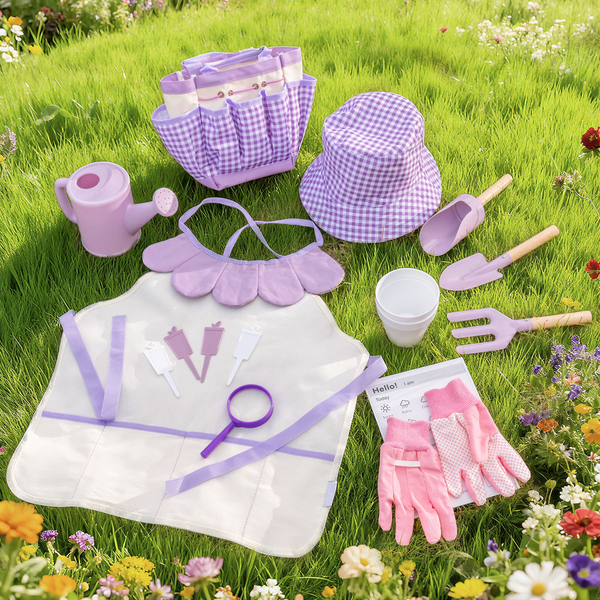 ROBUD Kids Gardening Set pink edition full contents laid flat on white showing tote bag, hat, apron, shovel, rake, fork and gloves