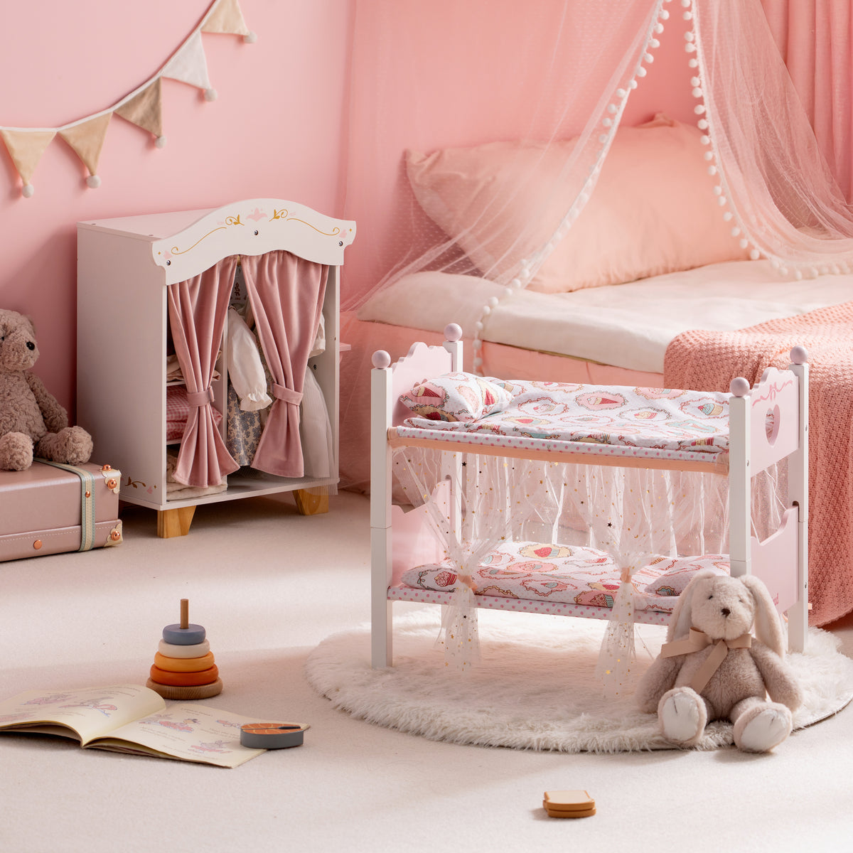 ROBUD white wooden doll bunk bed with canopy and pink wardrobe in a dreamy pink room with a stuffed rabbit on the floor.