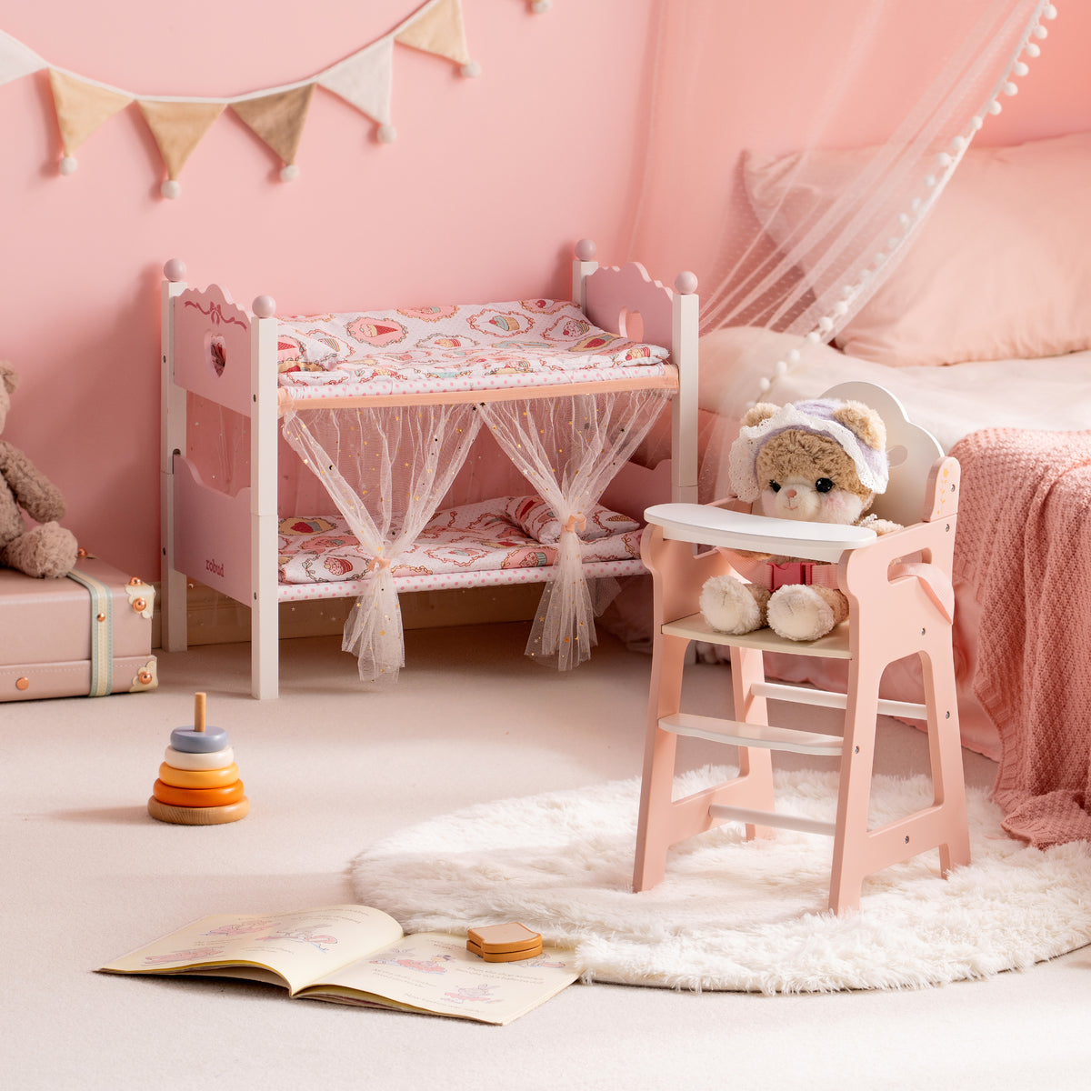 ROBUD white wooden doll bunk bed with star canopy and pink doll high chair displayed in a soft blush pink children's room.