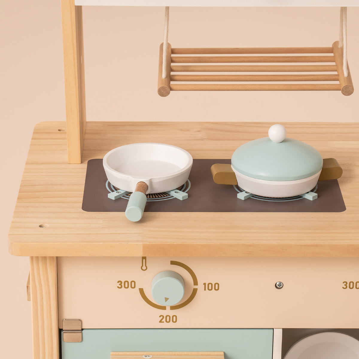 ROBUD WCF14 kitchen sink close-up with white basin and wooden gold faucet on natural wood counter.