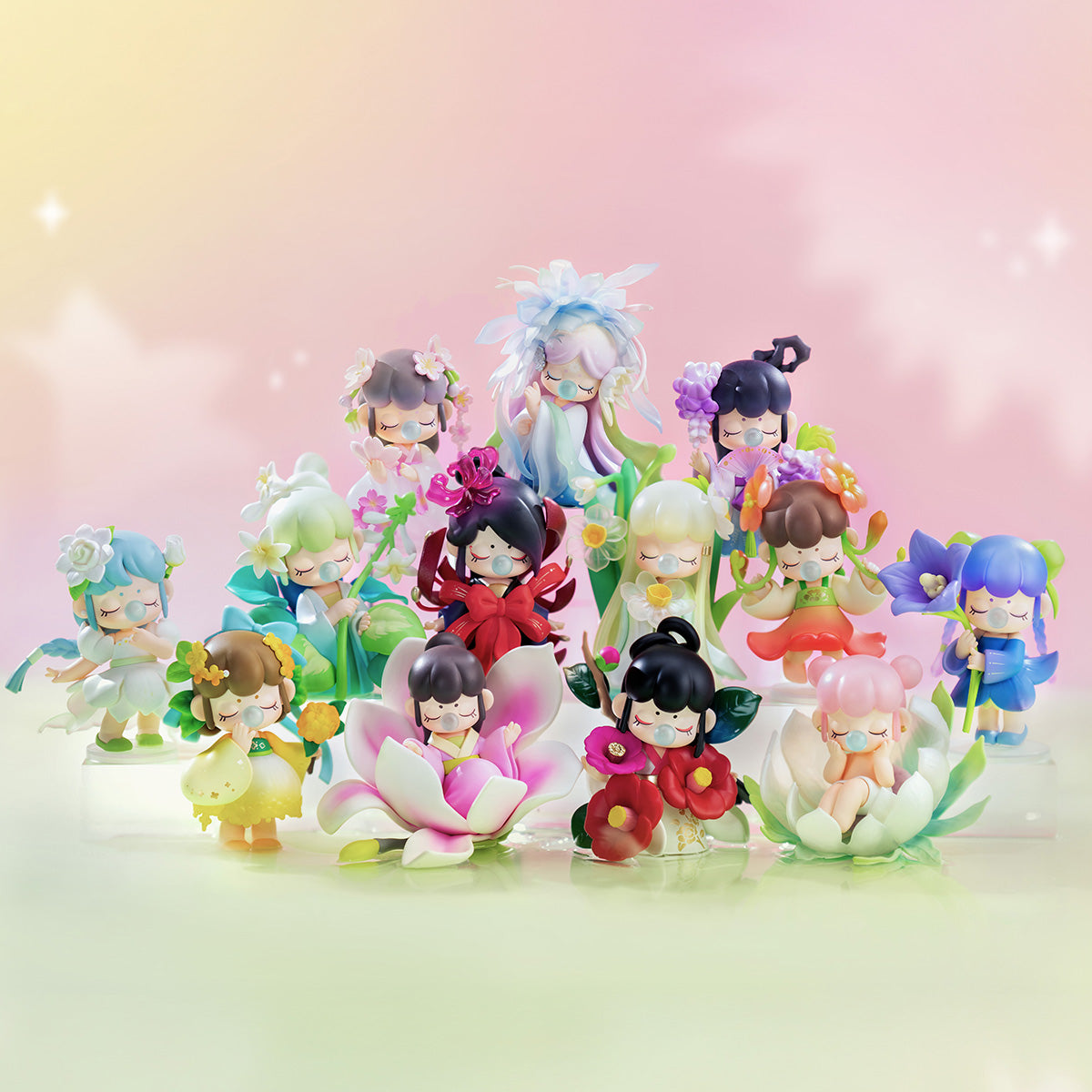 Rolife Nanci Flower Stories complete set of 13 flower spirit figures arranged together on a reflective surface with a pink and cream dreamy background showing all characters in the collection