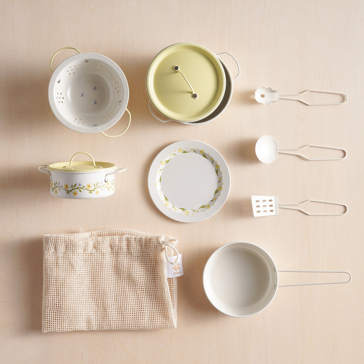 ROBUD Tinplate Pretend Cooking Utensils cream edition gift set near a Christmas tree with yellow lid stockpot, colander and utensils in box