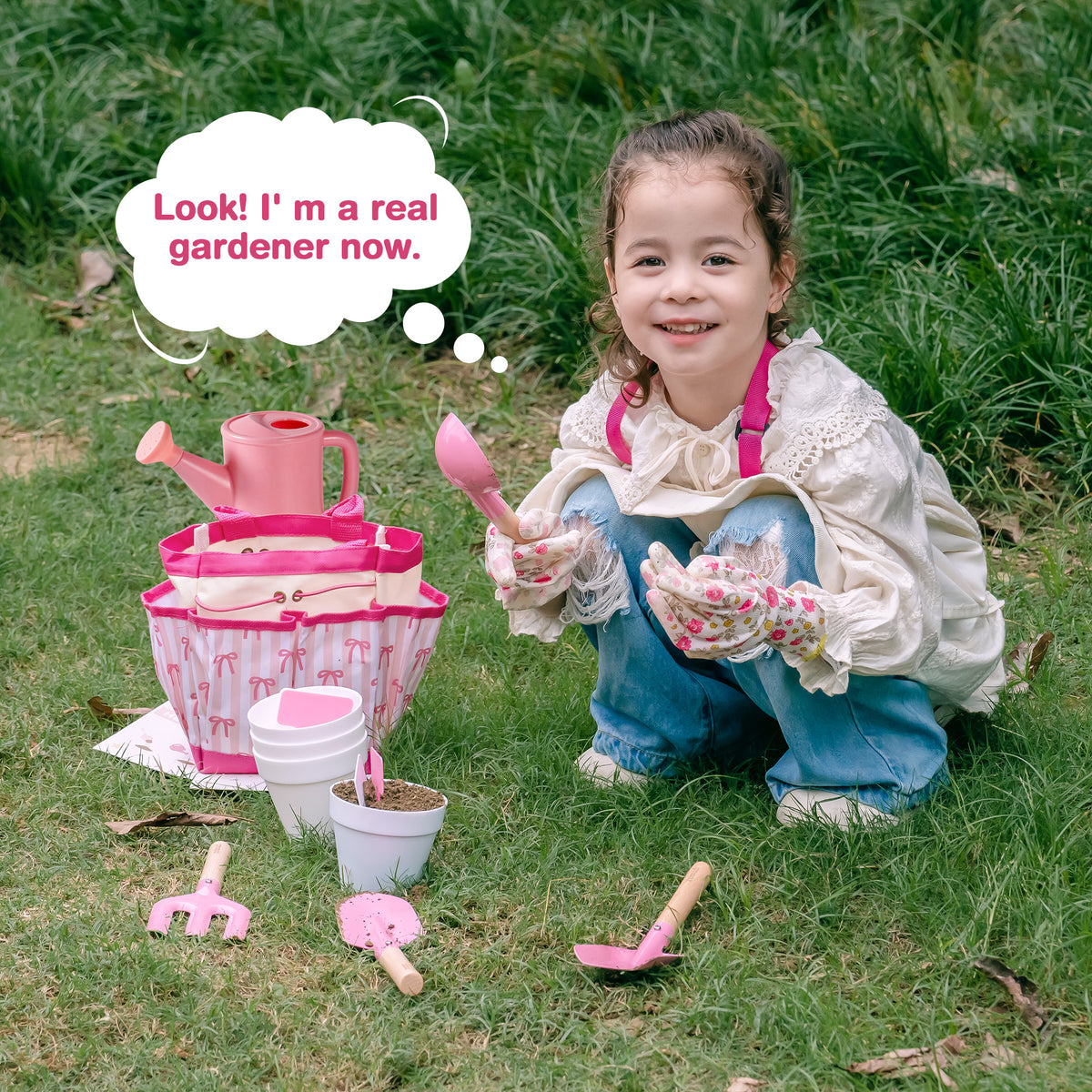 Young girl in apron crouching in garden smiling with ROBUD Bow Gardening Set tools and basket saying she is a real gardener