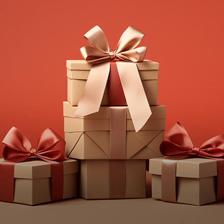 Robotime Online promotional gift stack showing wrapped presents with satin bows on a warm red background for seasonal gifting.