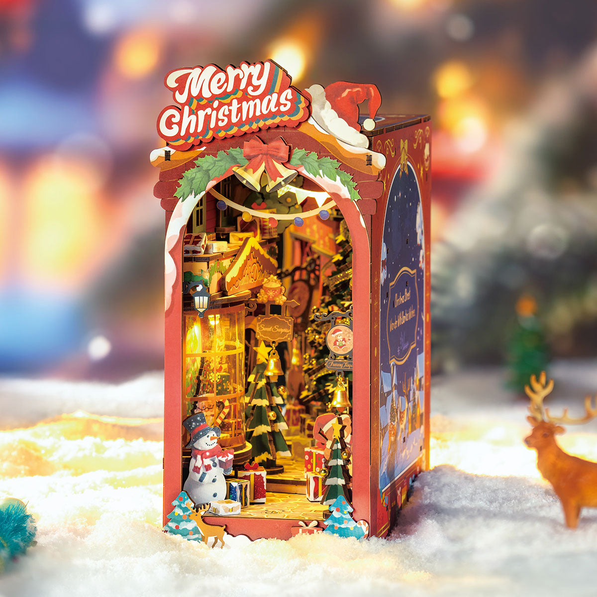 Rolife Christmas Street book nook glowing in snow with a reindeer figure and holiday lights.