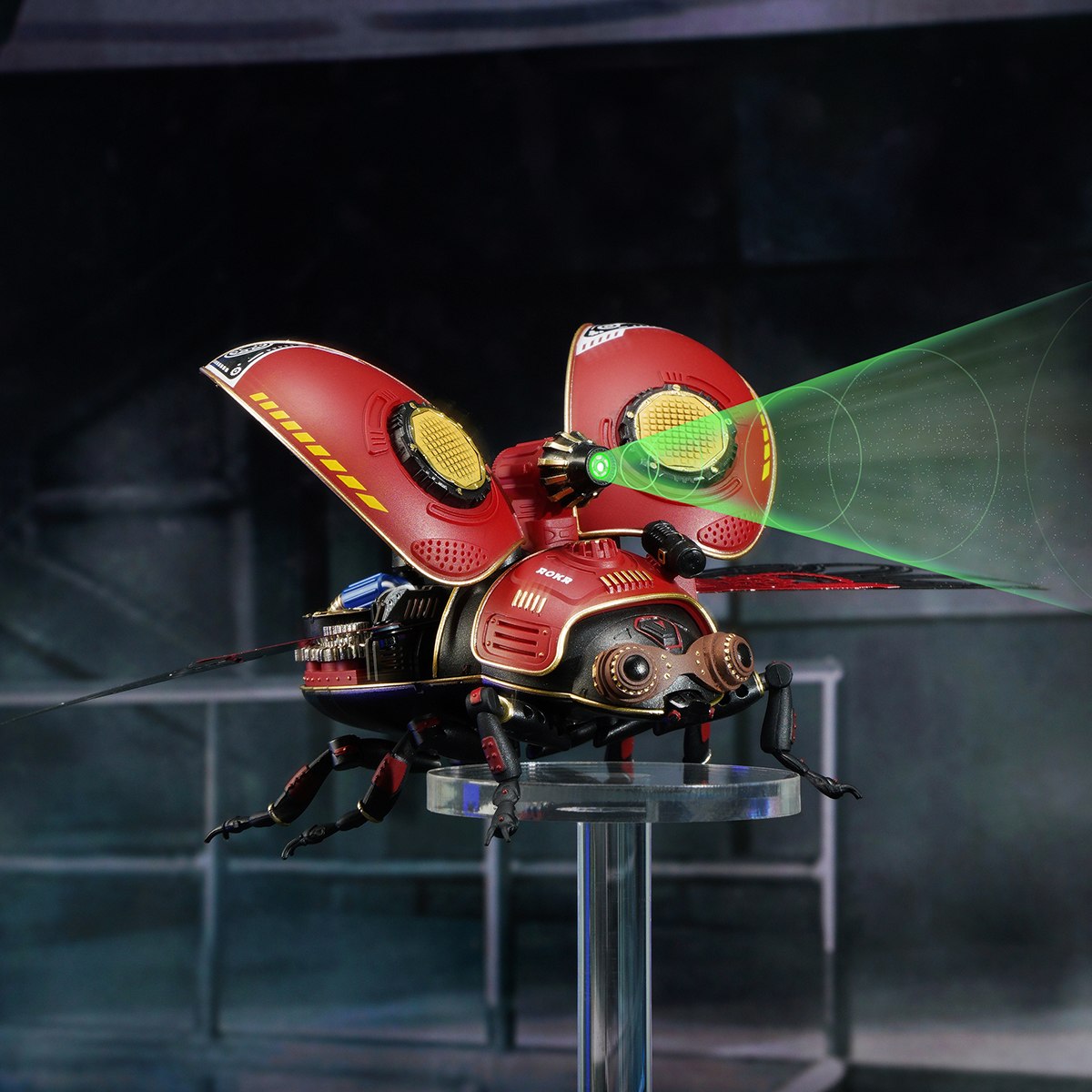 ROKR Scout Beetle 3D wooden puzzle mid-flight pose with wings open and green laser beams against a dark background