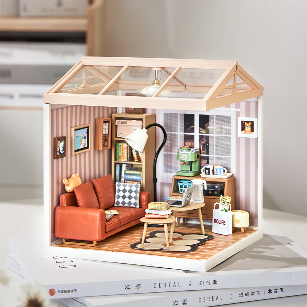 Rolife Cozy Living Lounge Super Creator Miniature House DW007 DIY book nook miniature kit, lifestyle scene on a wooden desk