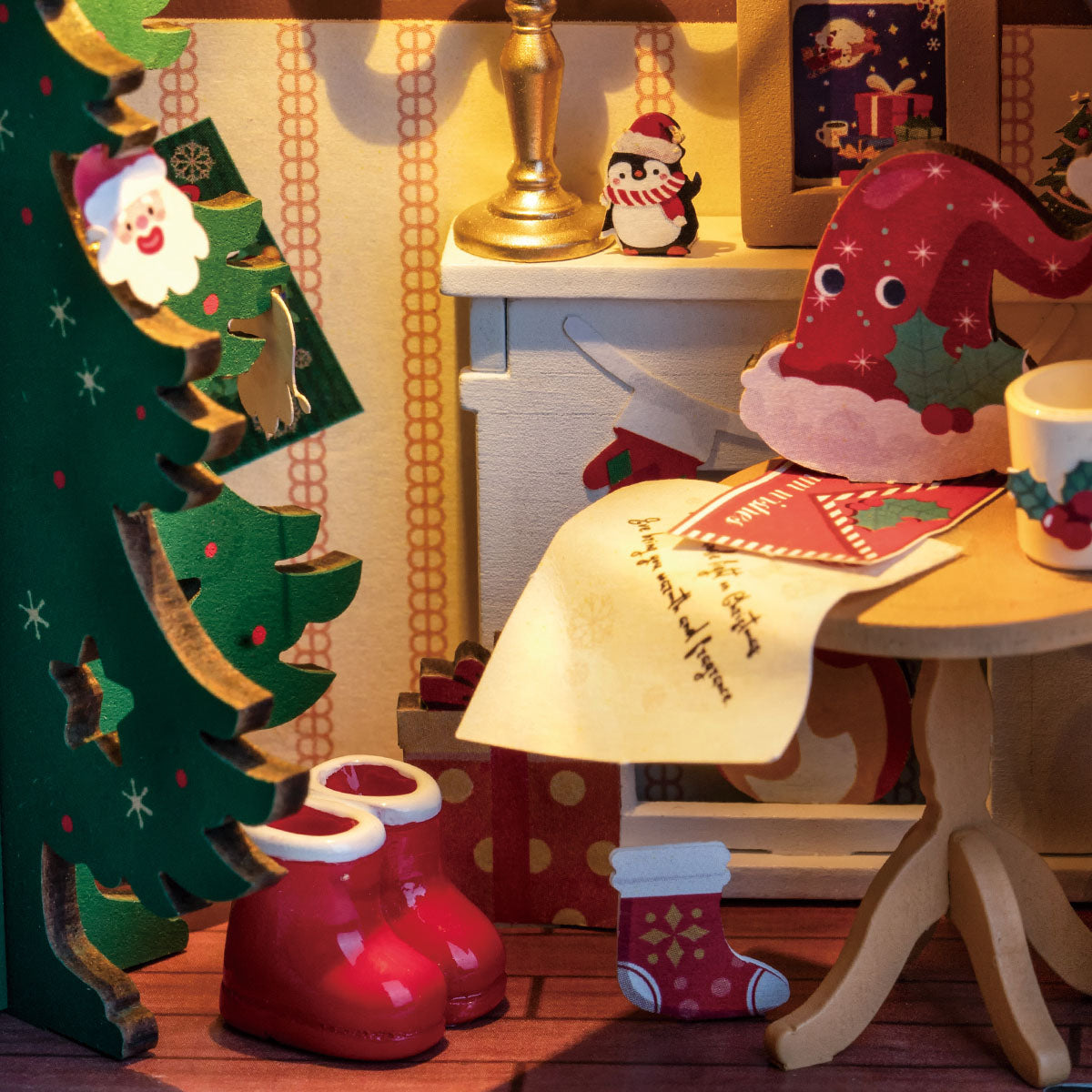 Rolife Twinkling Christmas House DS036 interior detail with miniature Santa figure, decorated tree, letters and red boots