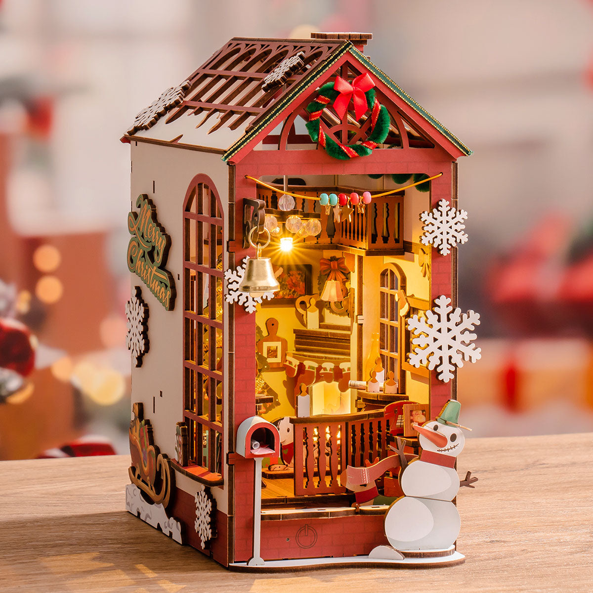 Rolife Christmas Indoor Scene book nook with red roof, snowflakes, snowman, and warm lights.