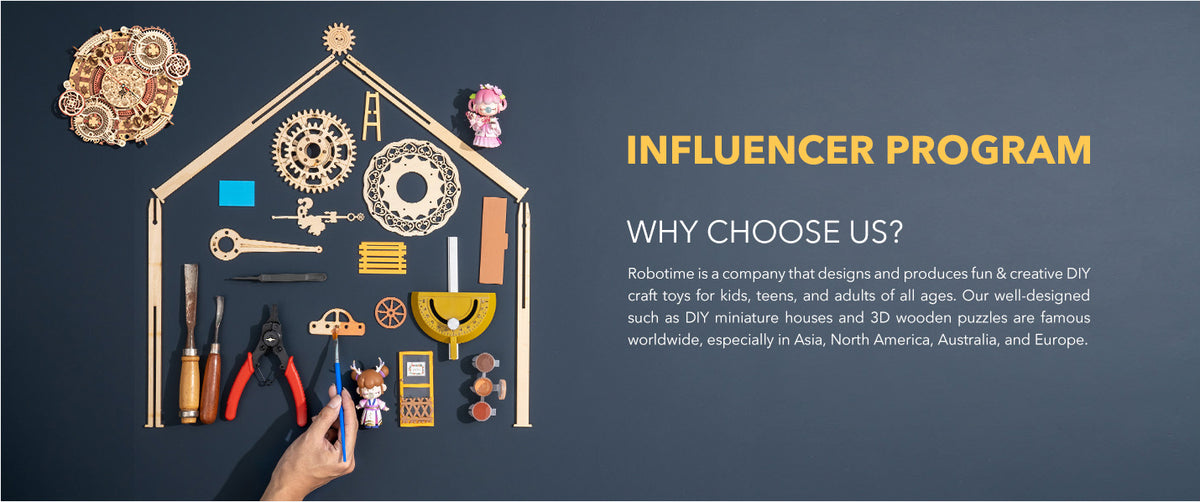 Robotime influencer craft display shows wooden tools and hanging model pieces on a dark wall.