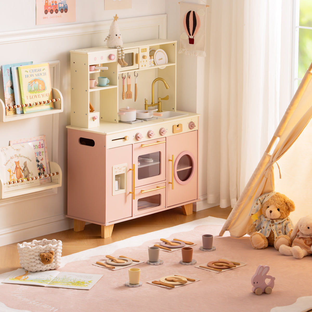ROBUD Glowwood pink play kitchen shown alone against a soft neutral wall, featuring an oven, sink, and upper display shelf.
