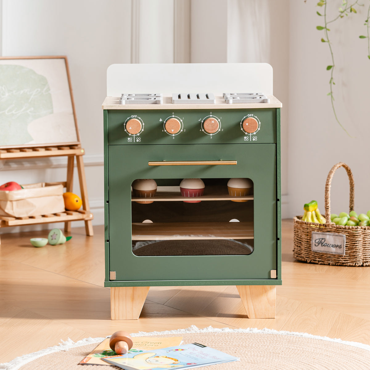 ROBUD vintage green wooden play oven standing in a bright playroom with realistic stovetop burners and copper-tone knobs