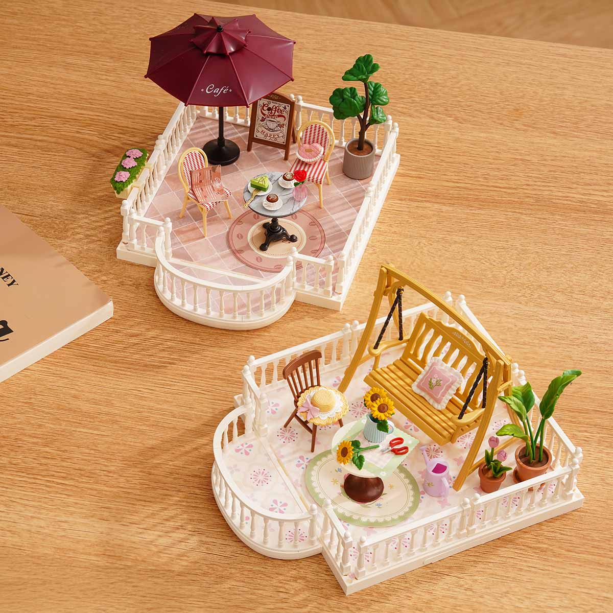 Two Rolife Super Creator assembled terraces side by side on a warm wooden surface
