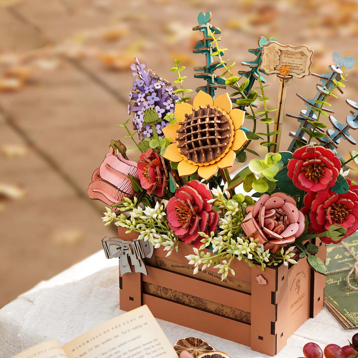 Rowood Wooden Bloom Box sunflower and red rose wooden arrangement displayed outdoors on autumn table